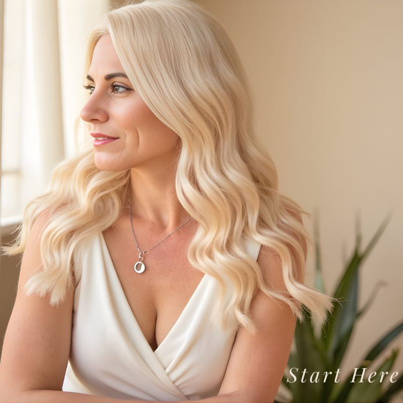 Erica Duran looking out a window with the words “Start Here” — guide to Paid For Your Presence® and business clarity