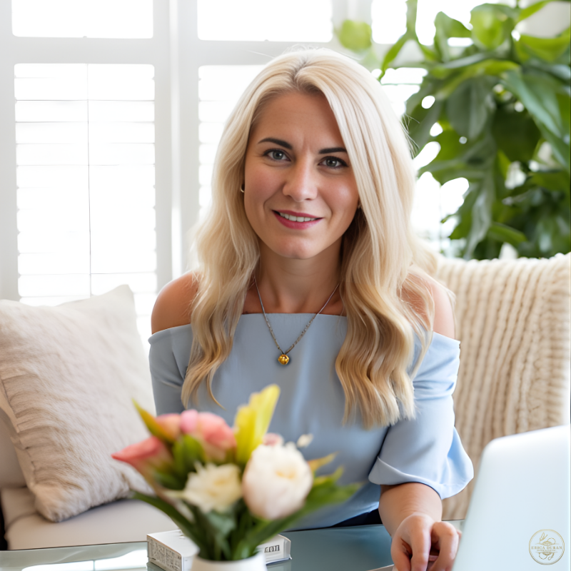 Erica Duran overlooking the ocean from a balcony, symbolizing clarity, structure, and intentional presence.