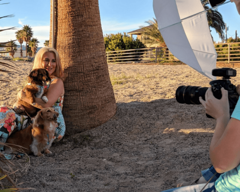 Behind the scenes of Erica Duran during a professional media photoshoot with two dachshunds, preparing for podcast interviews, articles, and media appearances.